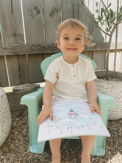 Toddler wearing organic cotton muslin shirt and shorts for baby lounging and play
